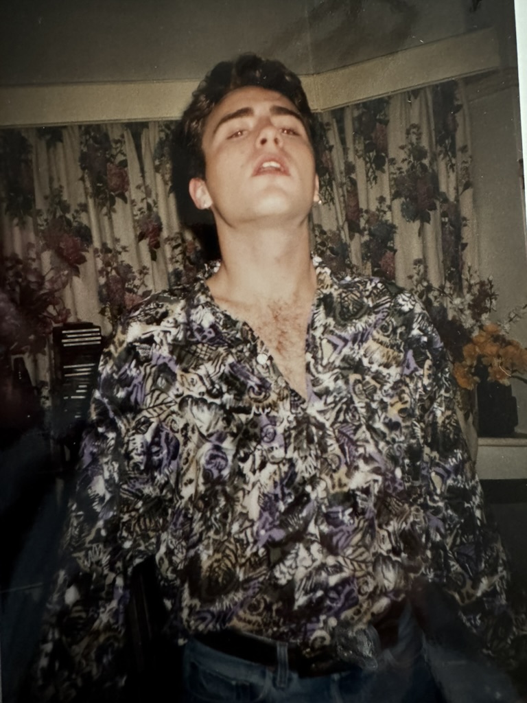 An archival photograph of Mark Stevens as a young man