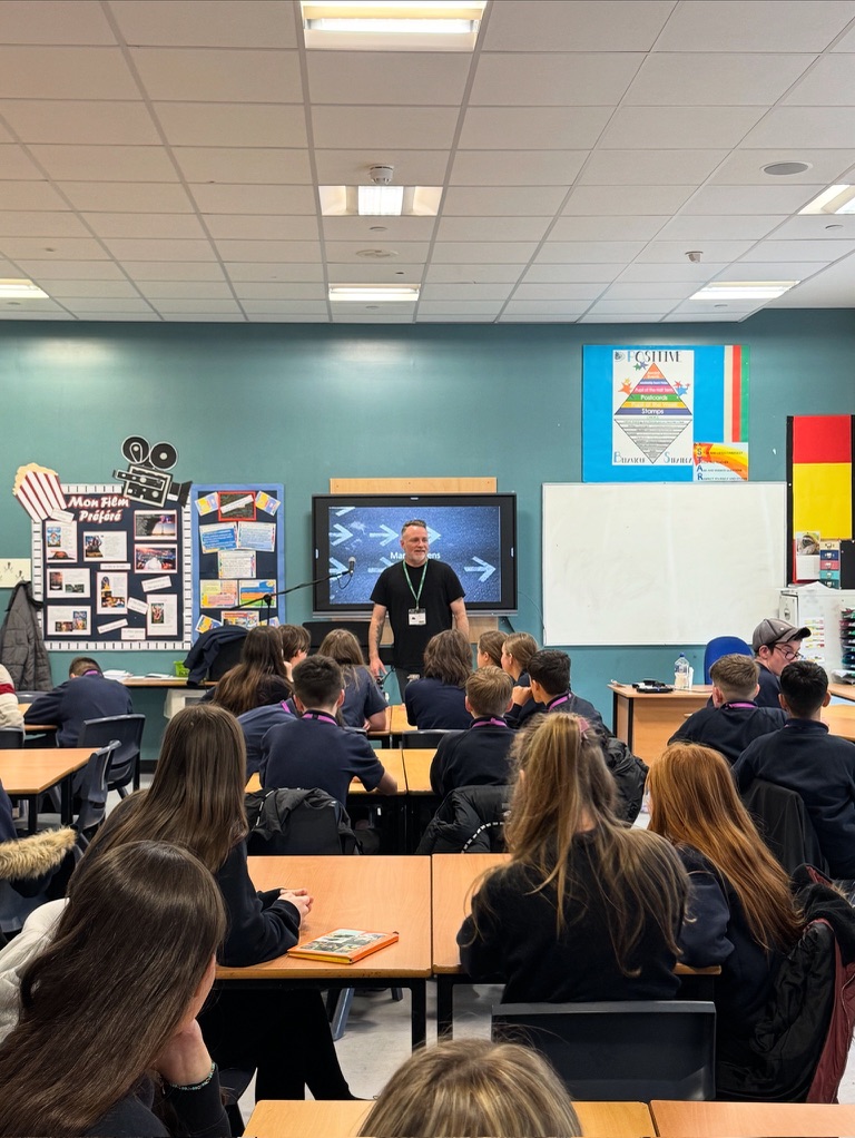 Mark Stevens delivering a Sound of Change session to young people in a classroom