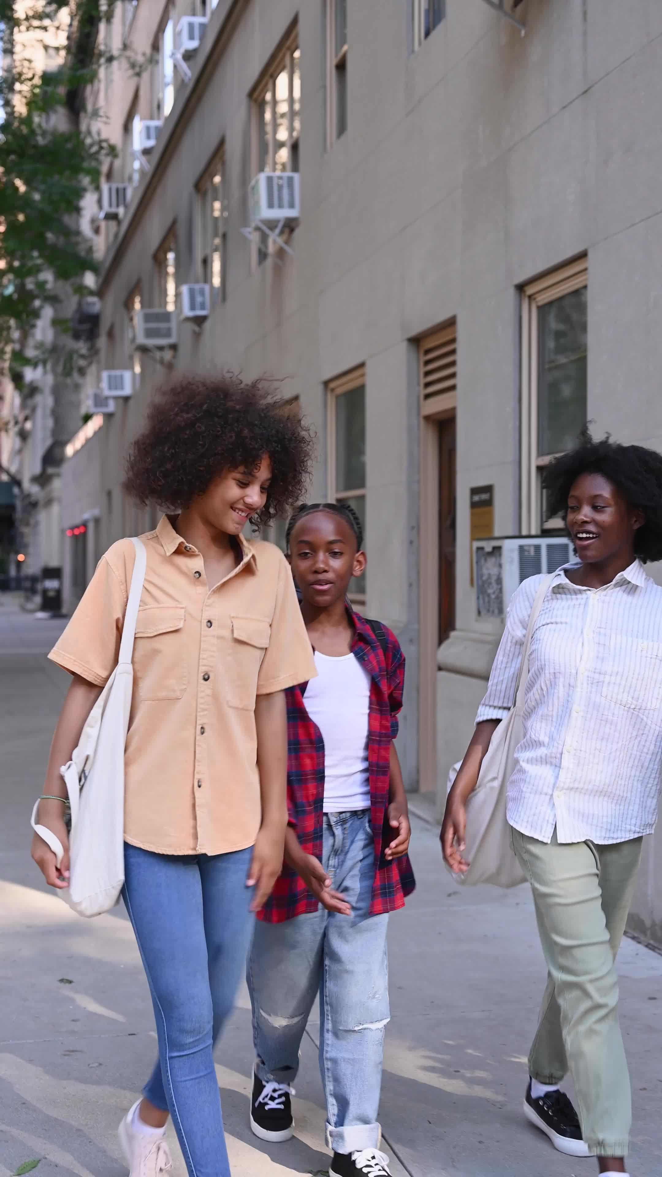 Young people sharing a conversation while walking together